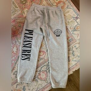 PLEASURES X N.E.R.D. Sweat Pants Medium Grey